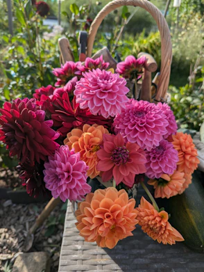 A basket filled with lots of colorful flowers