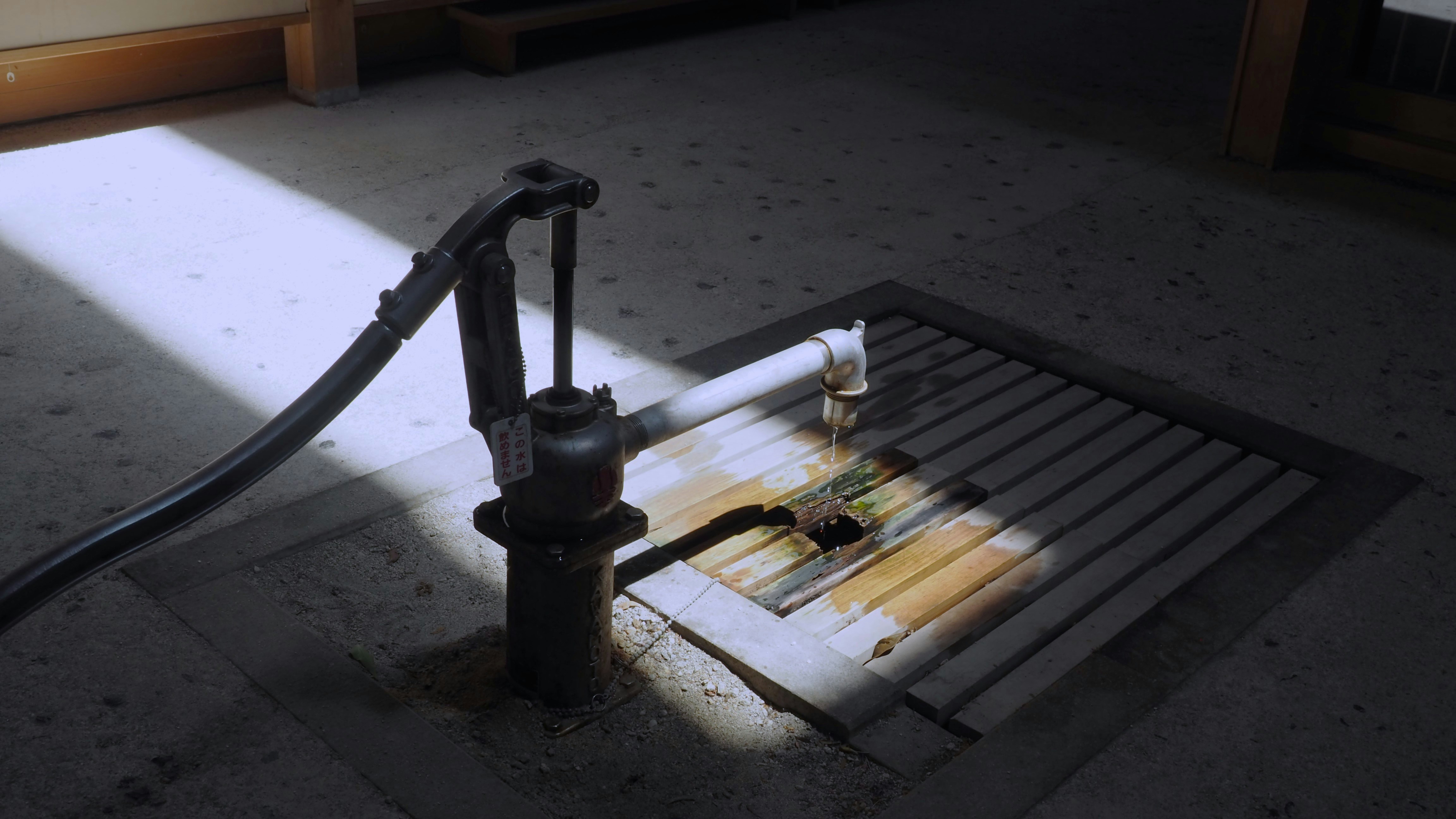 A fire extinguisher sitting on the floor in a room