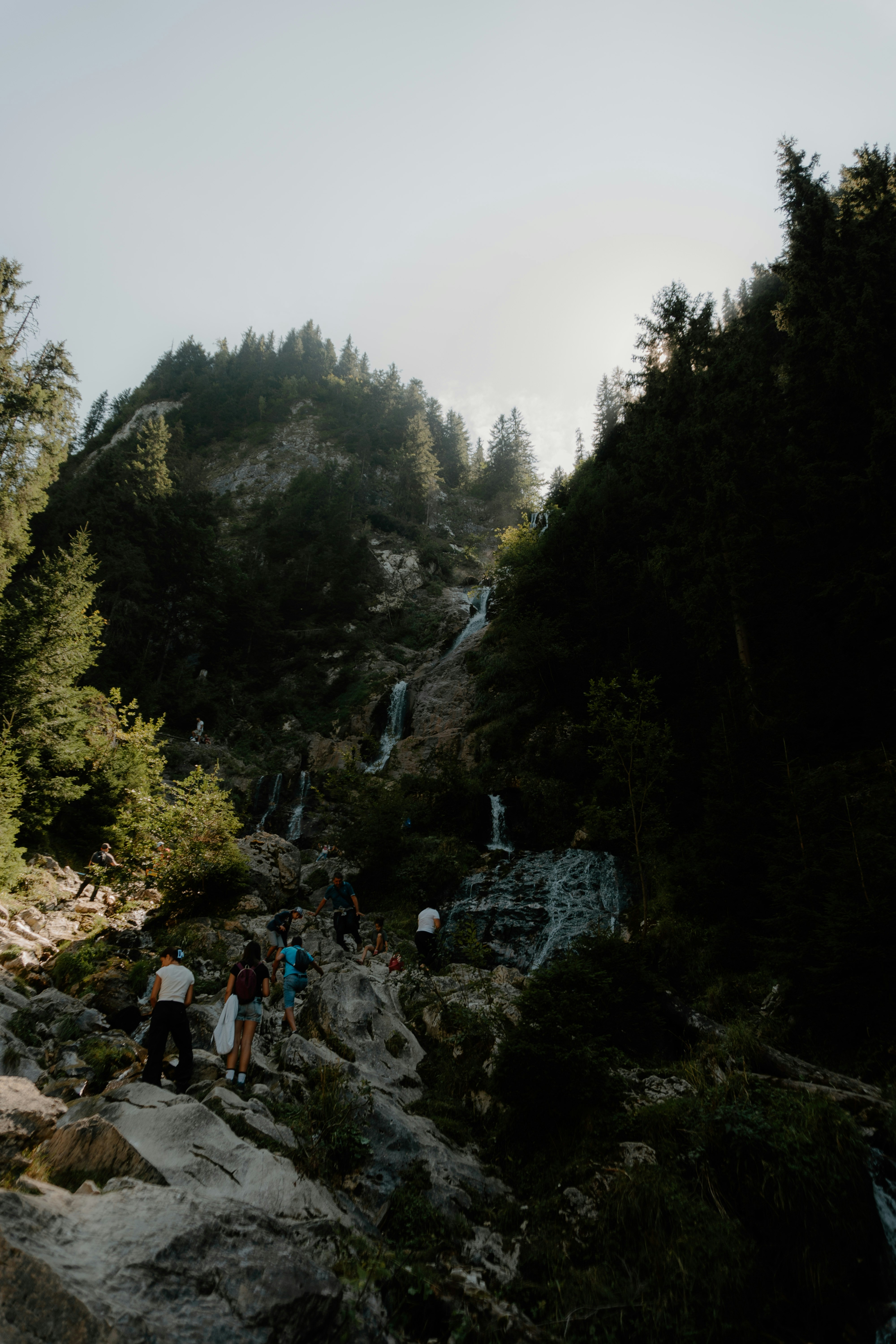 A group of people standing on a rocky cliff