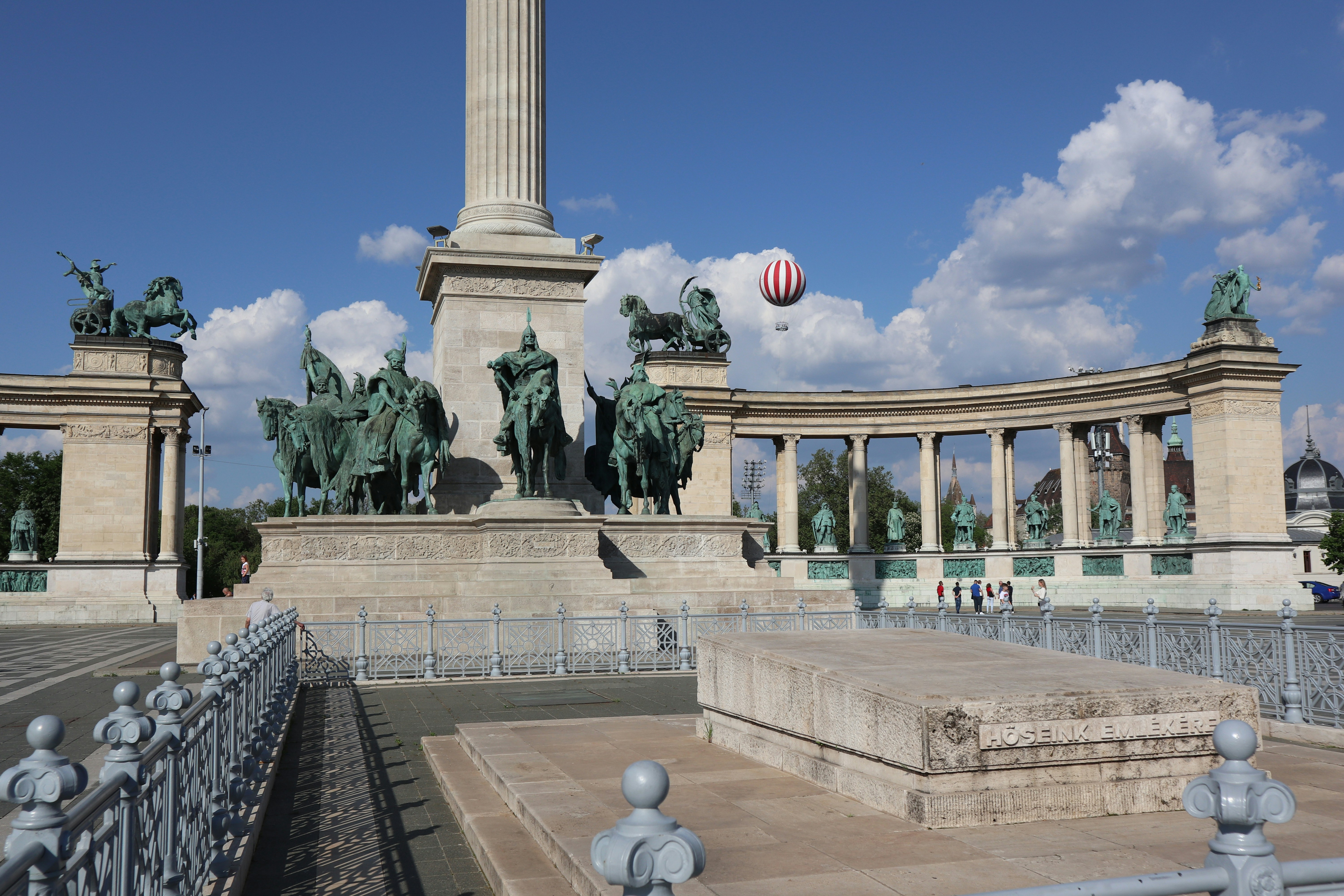 A monument with a clock on top of it