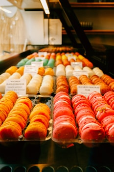 A display case filled with lots of different types of donuts