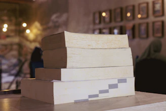A stack of books sitting on top of a table
