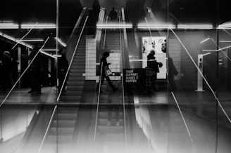 A black and white photo of a train station