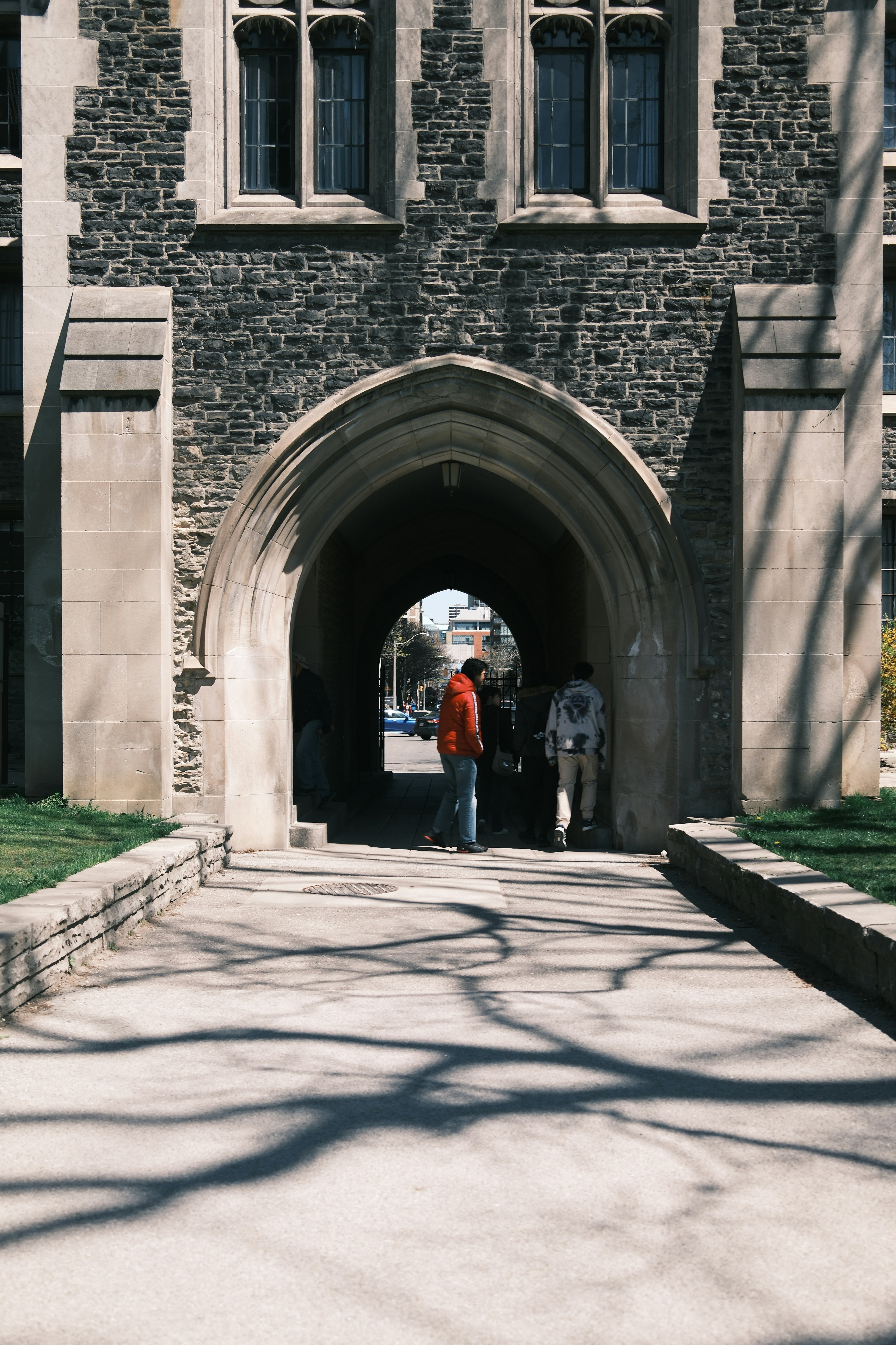 Two people are standing in the entrance to a building