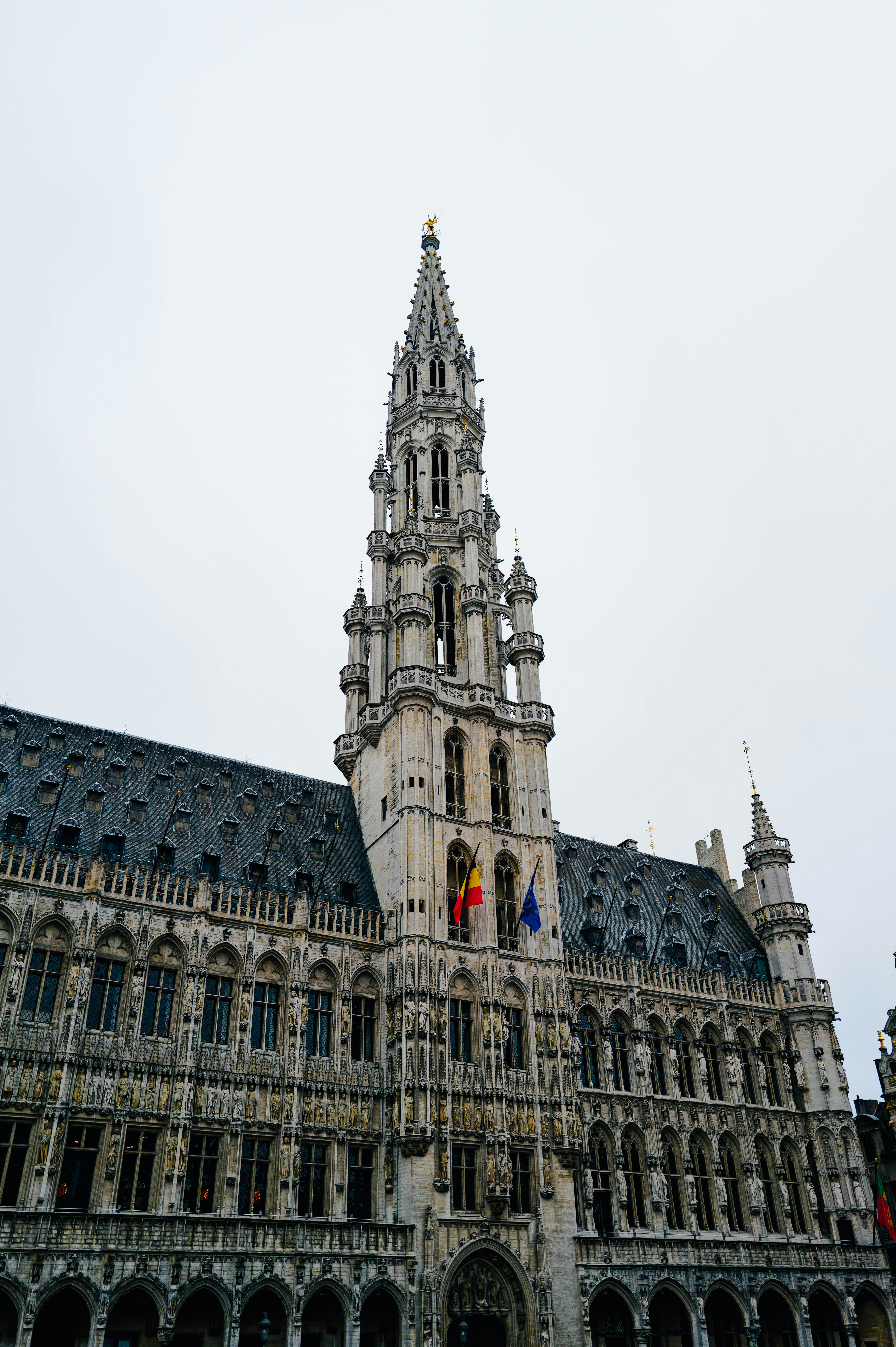 A very tall building with a clock on it's side