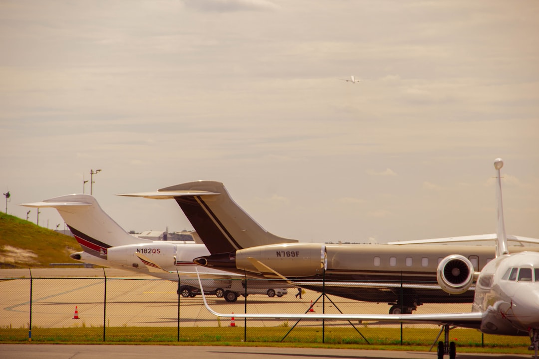 A couple of planes are parked on the runway,