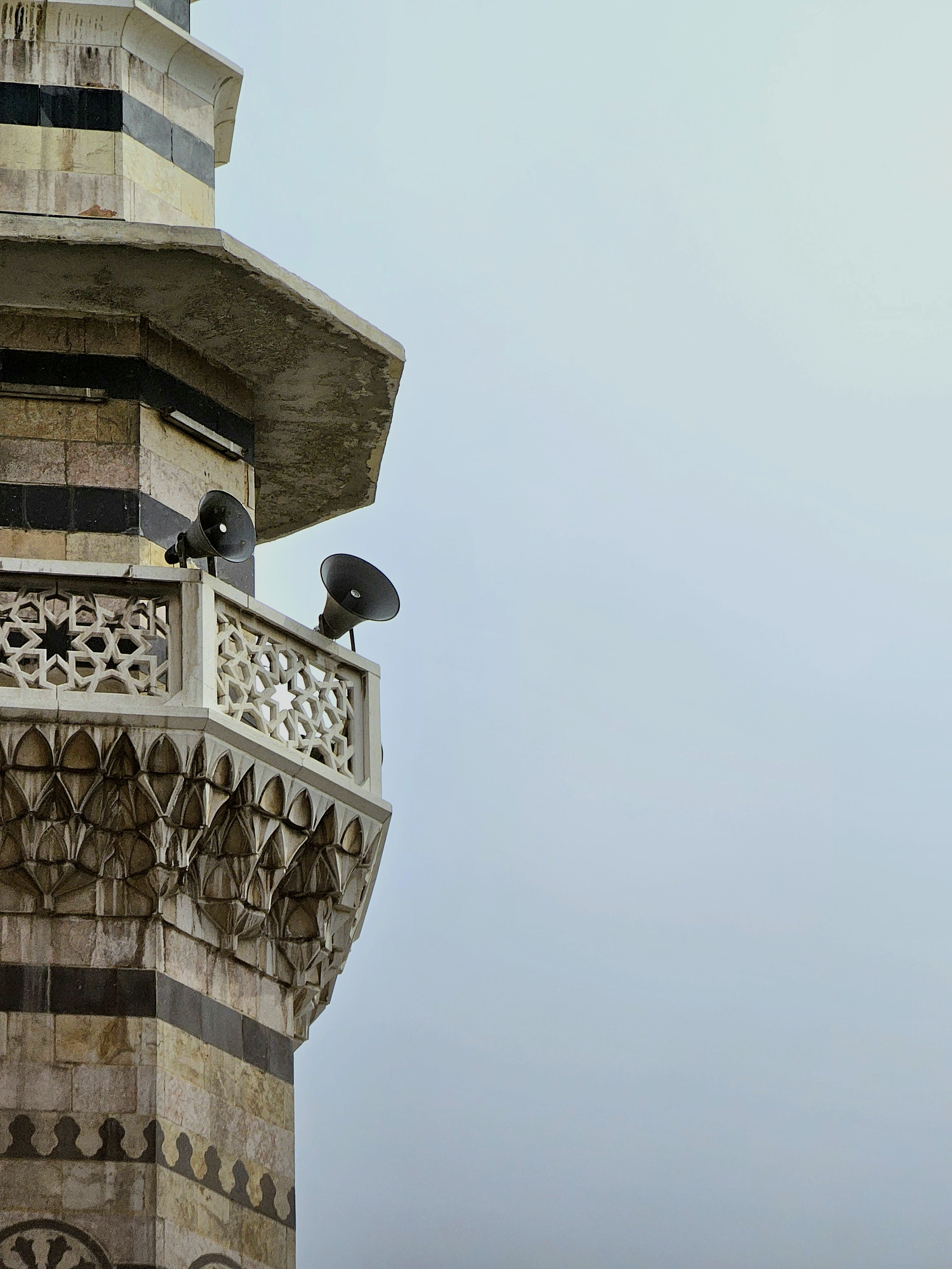 A tall tower with a clock on the top of it