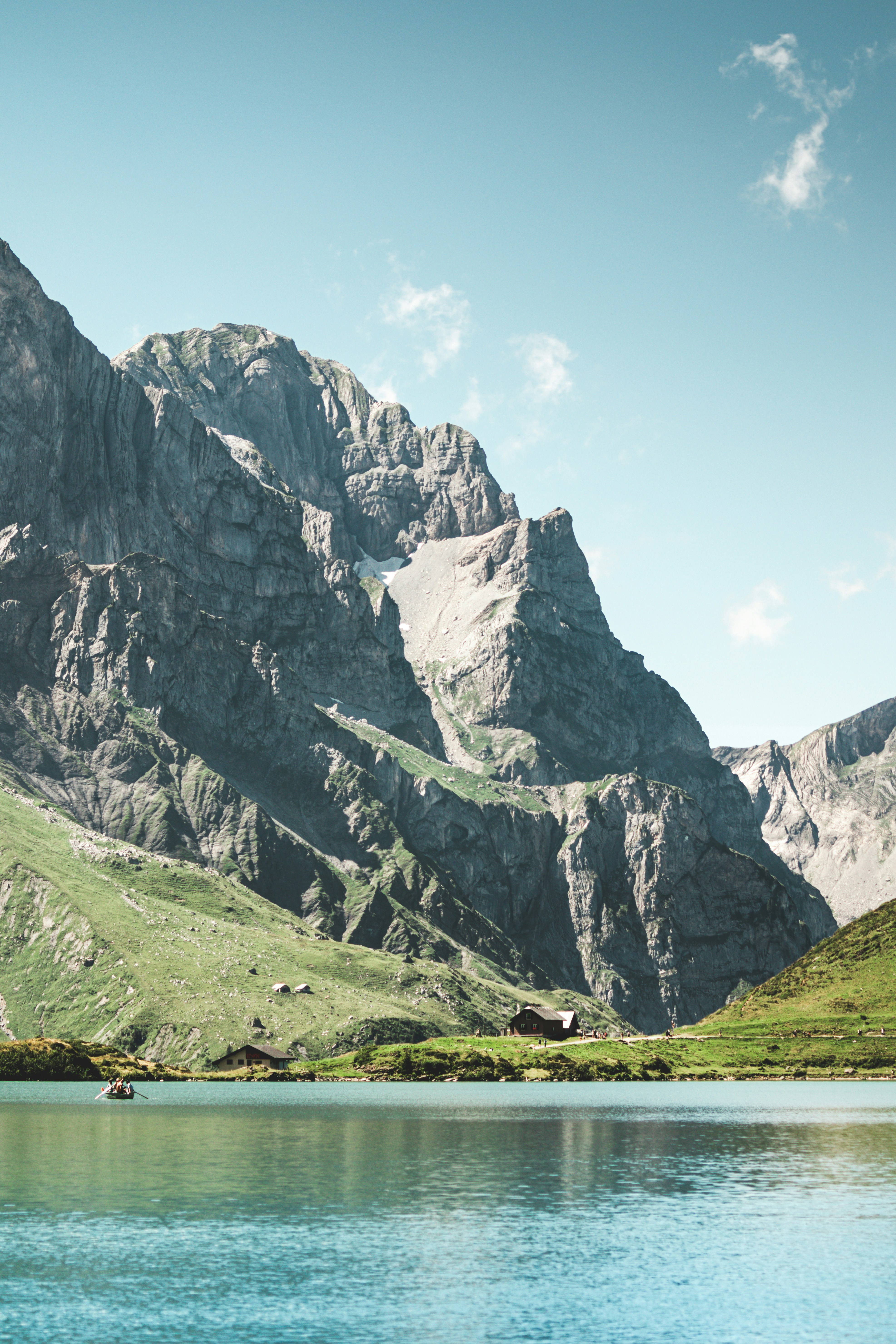 A mountain range with a lake in the foreground