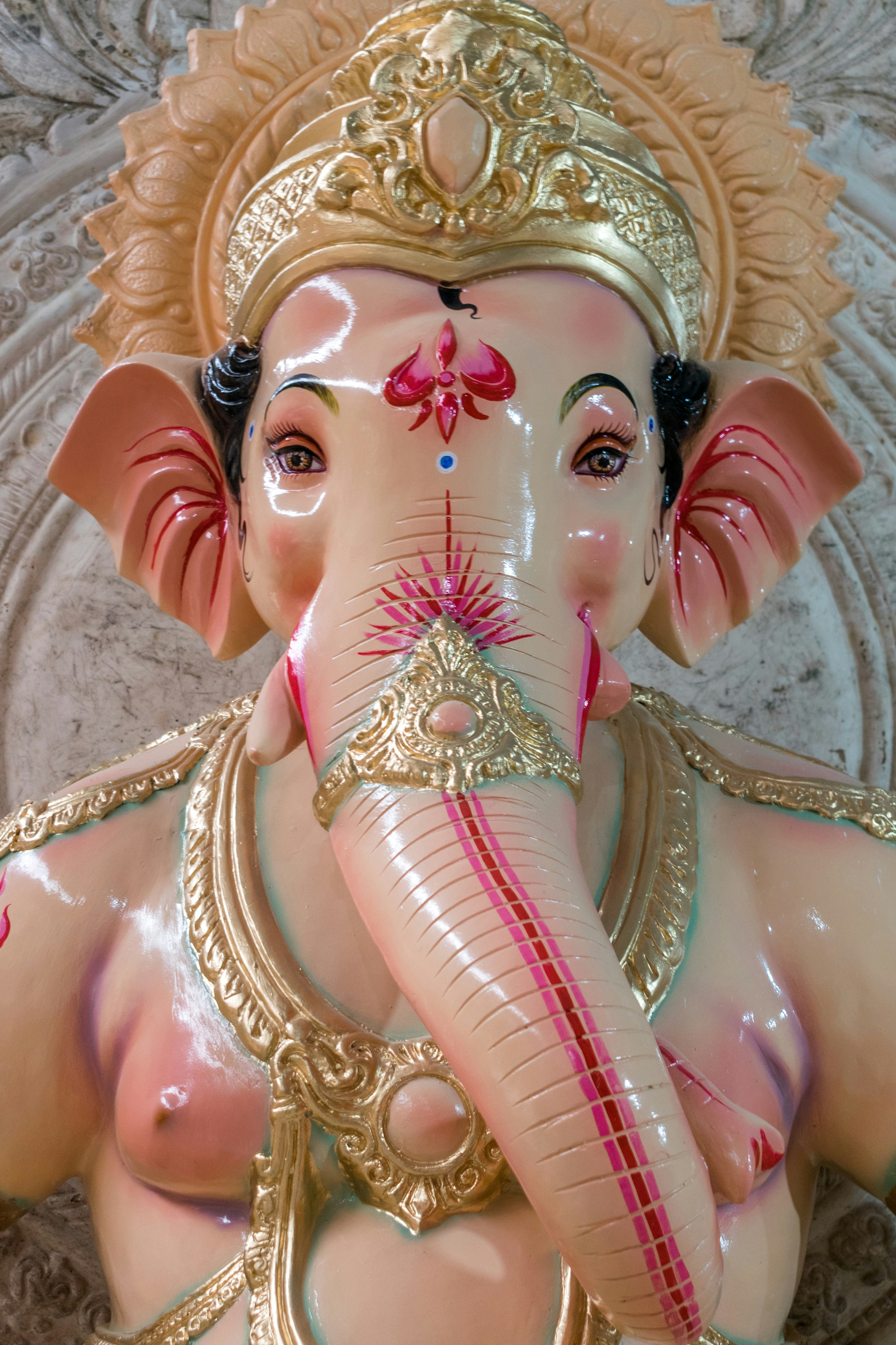 A statue of an elephant with a crown on it's head