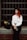 A woman with red hair sitting on a step