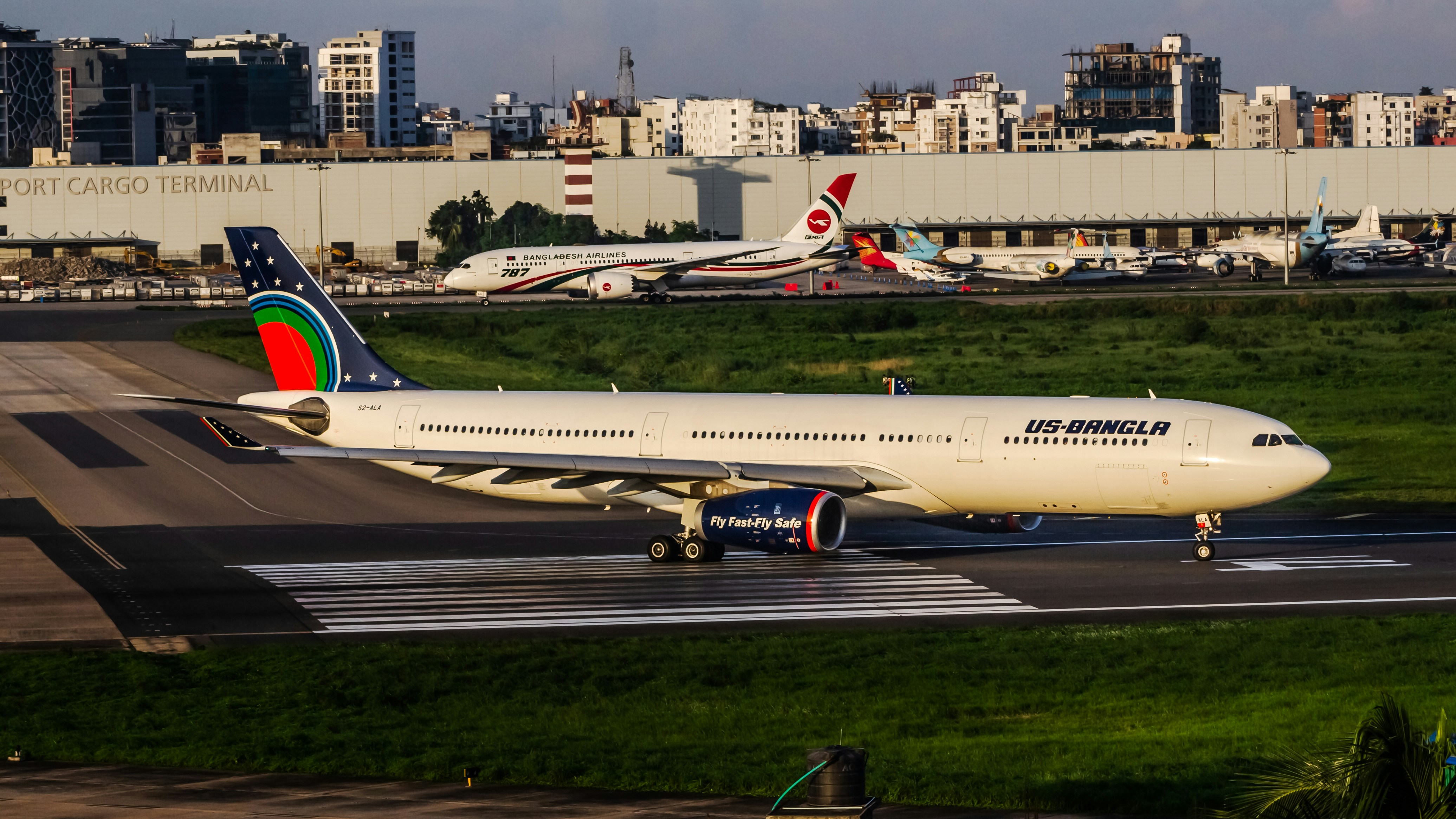 A large jetliner sitting on top of an airport runway, 