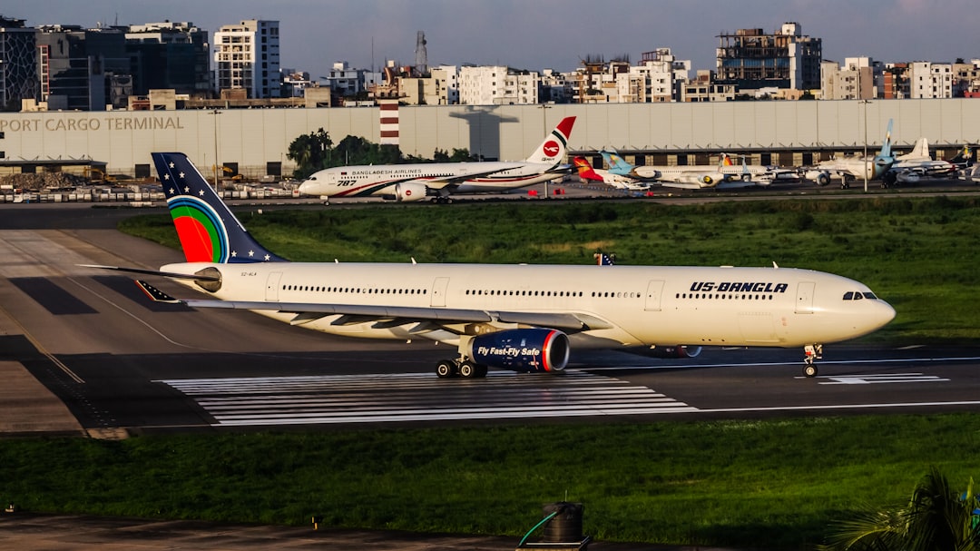 A large jetliner sitting on top of an airport runway,