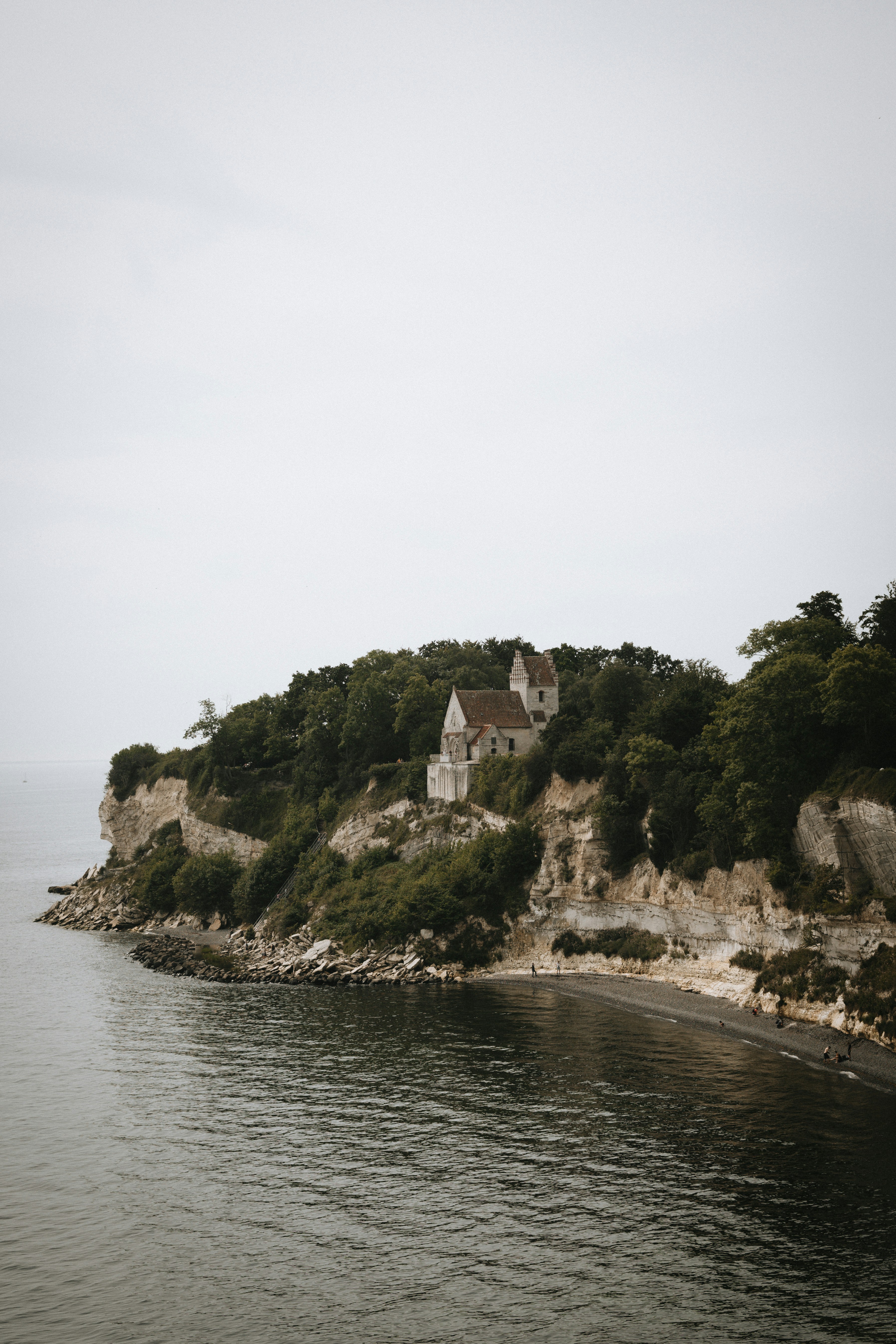 A small island in the middle of a body of water