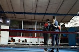 A man standing on top of a boxing ring