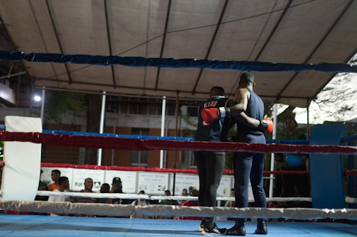 A man standing on top of a boxing ring