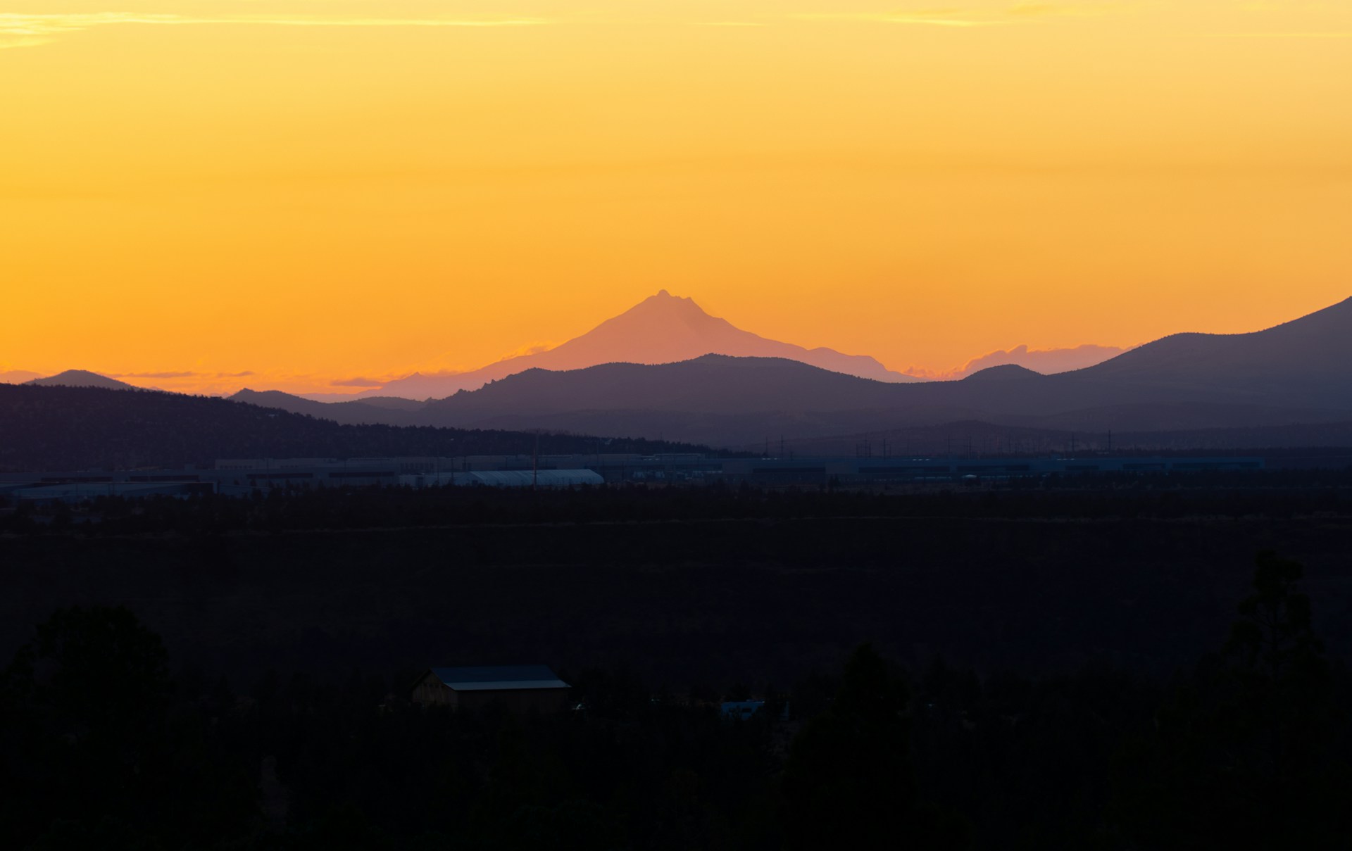 A view of a mountain range at sunset