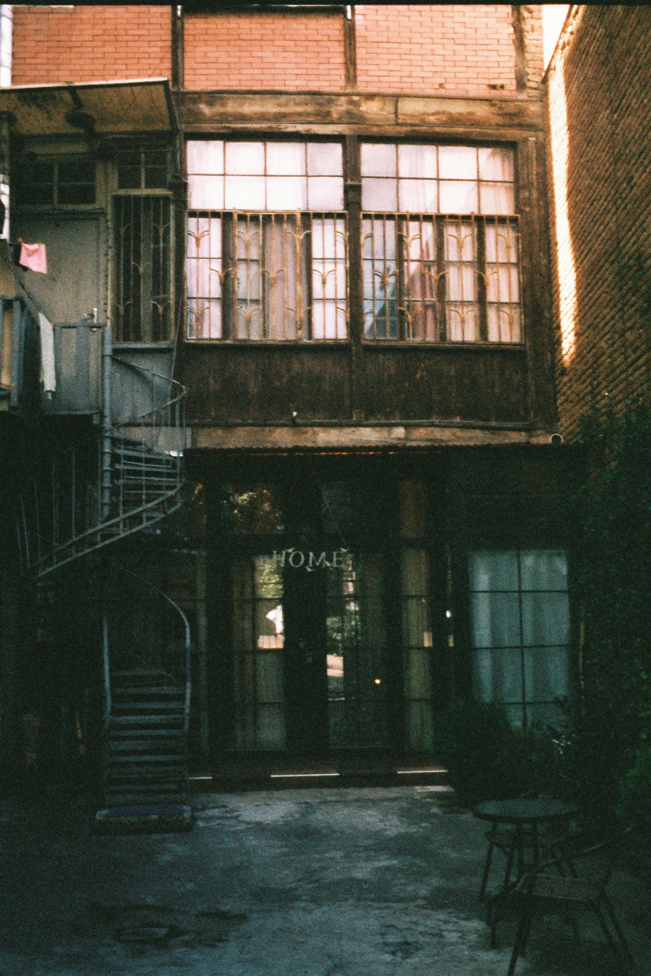 An old building with a staircase leading up to it