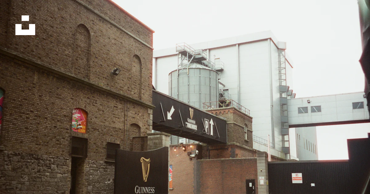 A building with a sign on the side of it photo – Free Guinness ...
