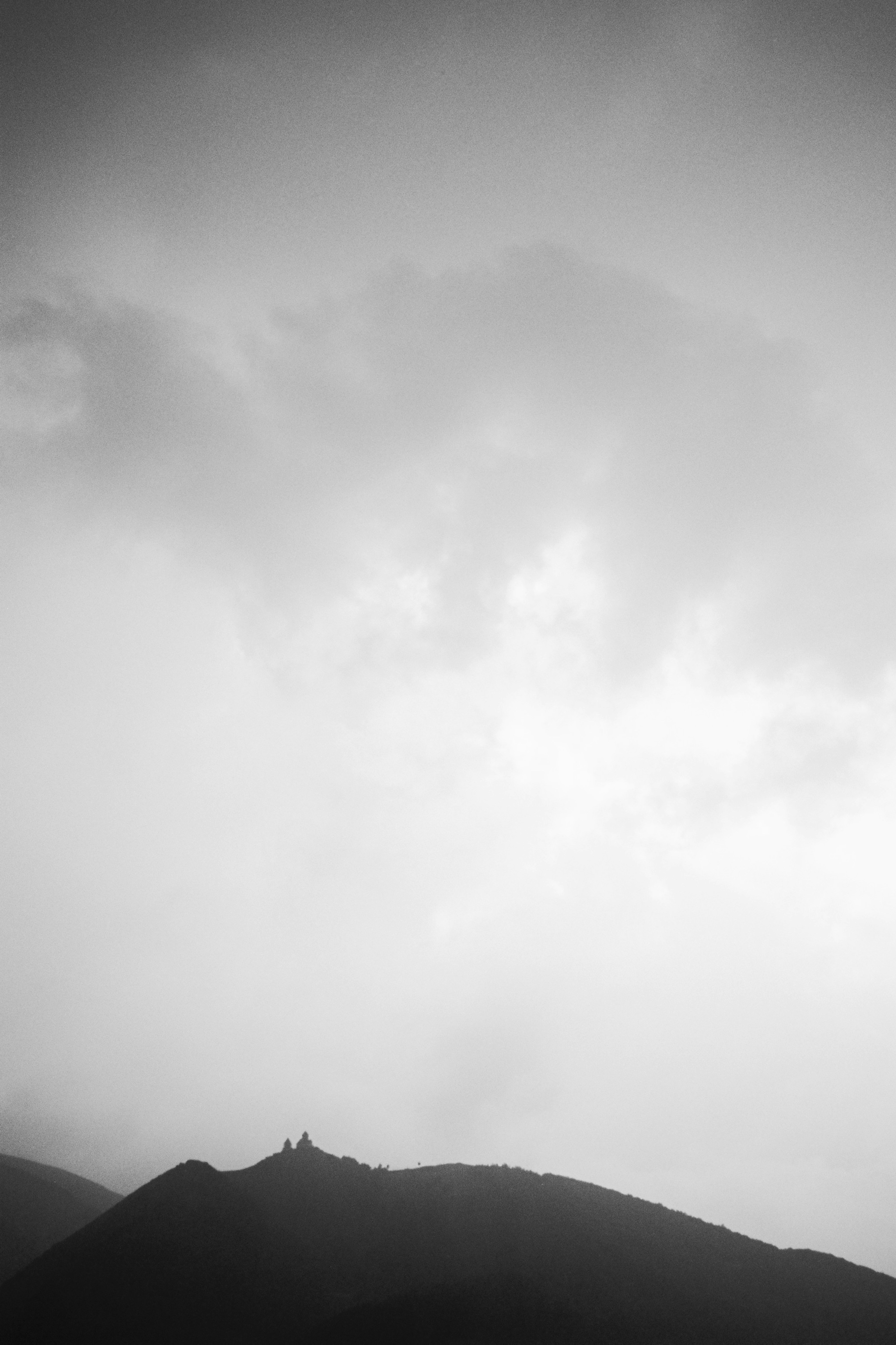 A black and white photo of a mountain