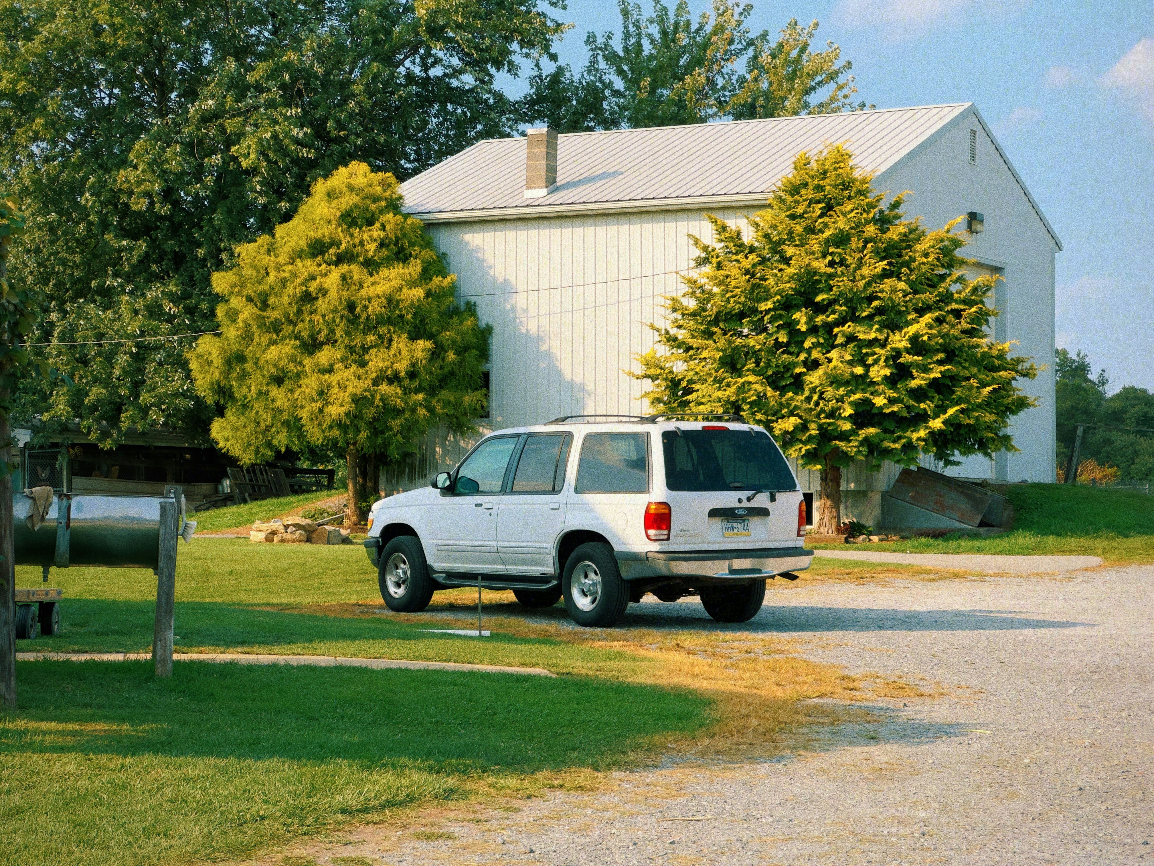 A professional HVAC technician's van parked in front of a modern Westlake home, with a clean, recognizable company logo - emergency heating repair westlake