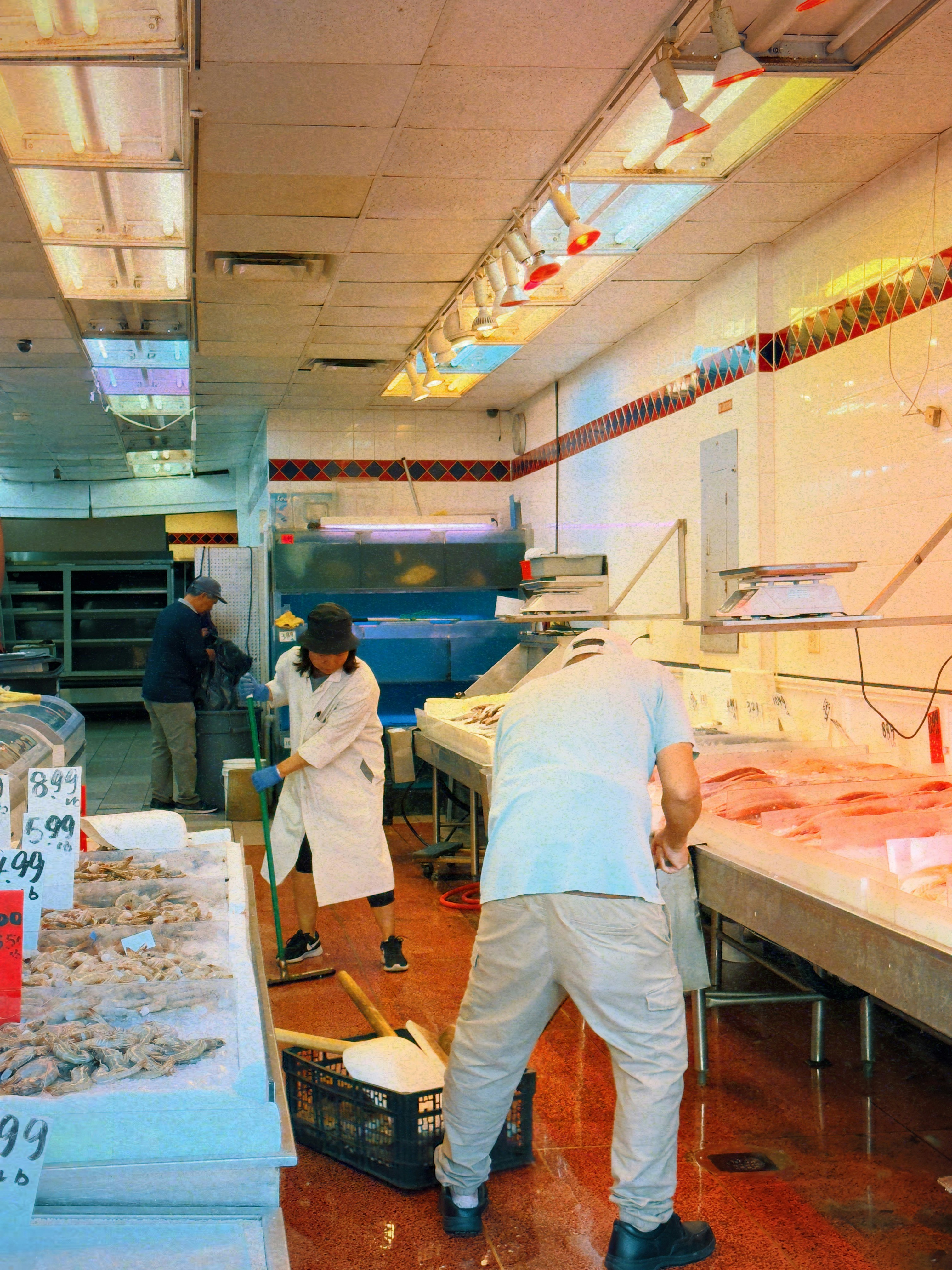 A couple of men working in a kitchen