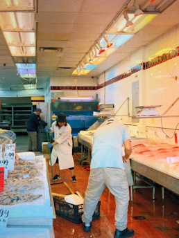 A couple of men working in a kitchen