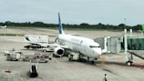 A large jetliner sitting on top of an airport tarmac