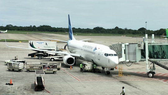 A large jetliner sitting on top of an airport tarmac