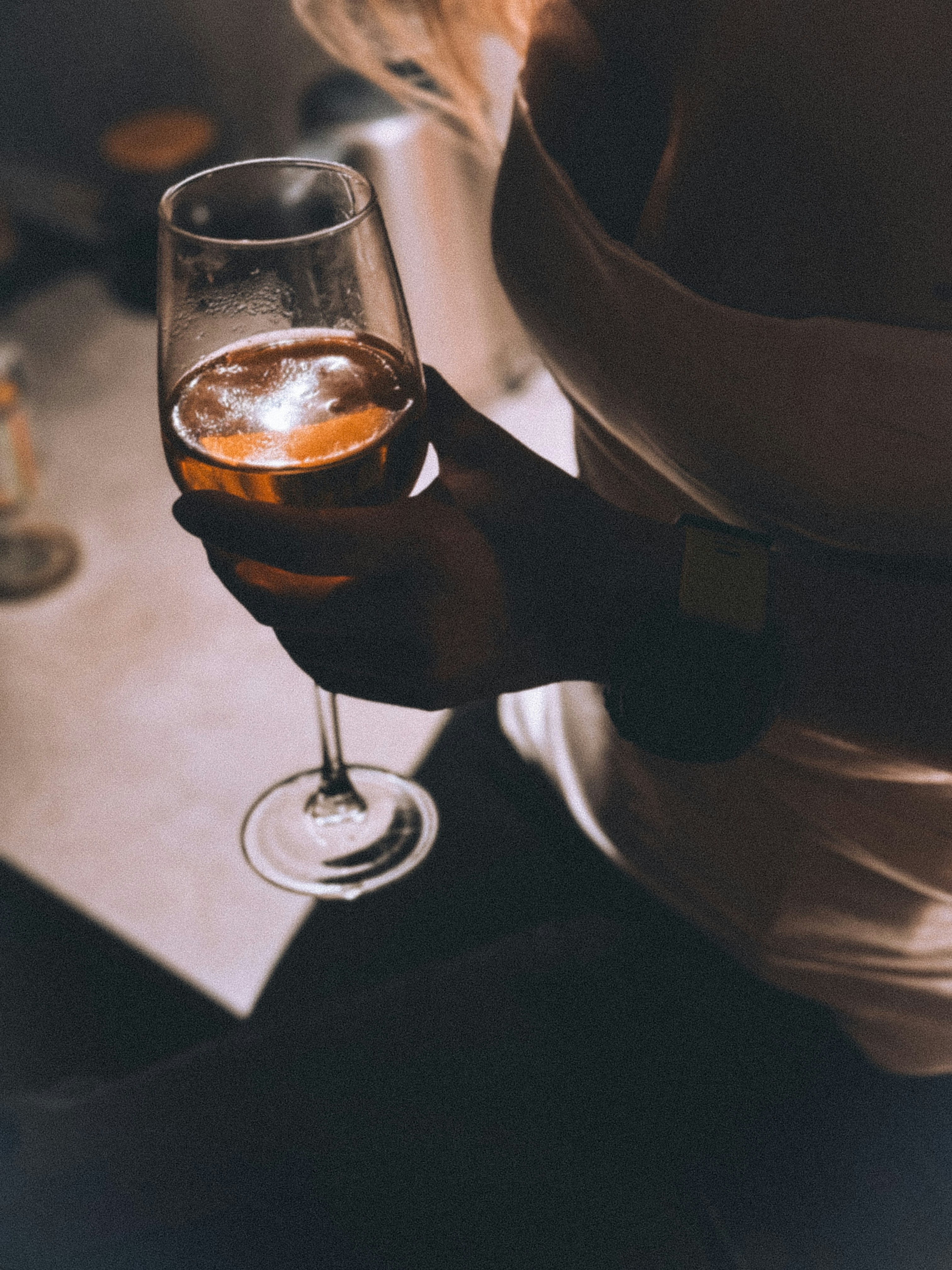 A woman holding a glass of wine in her hand photo – Free Party Image on  Unsplash, image size:3000x4000