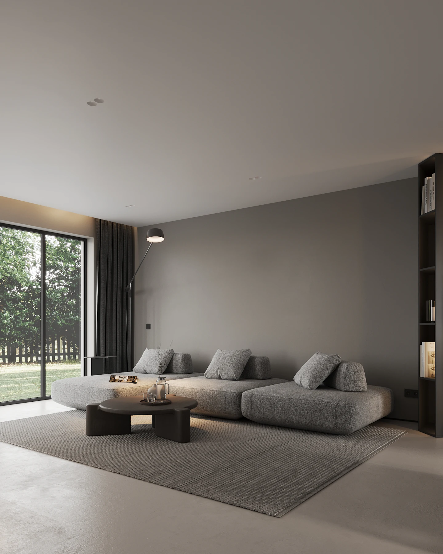 Low grey sofa and shelving in soft daylight