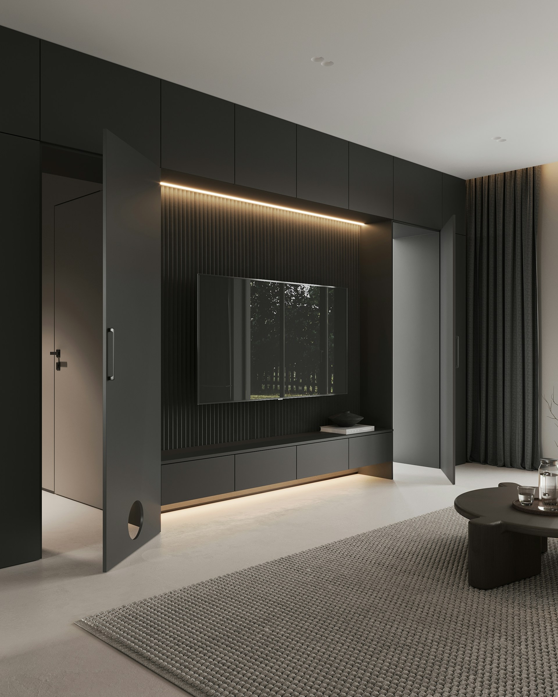 A living room with a couch, coffee table and television