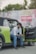 A man sitting in the back of a green car