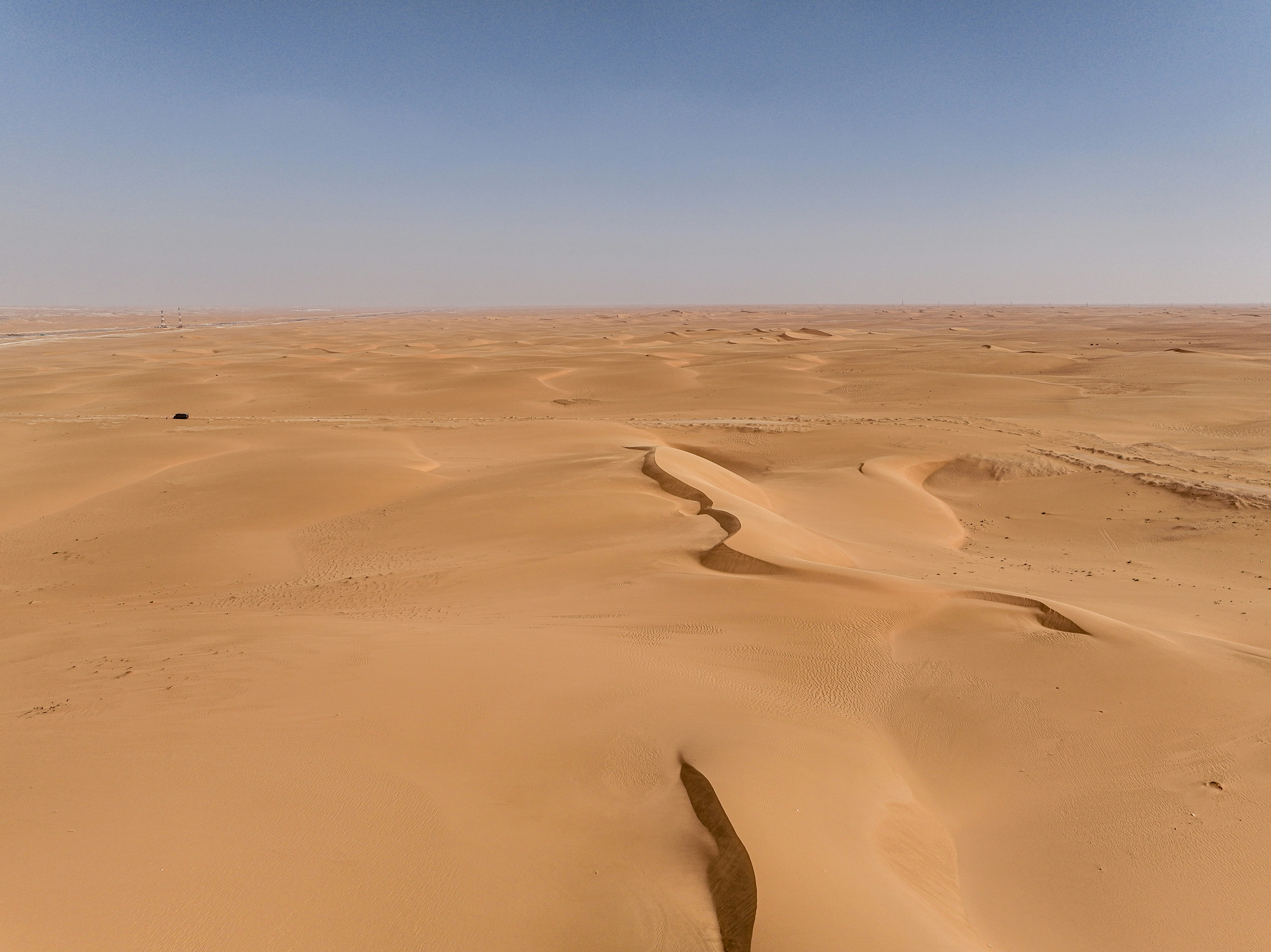 Wide landscape and sky representing long-distance travel in Canada