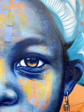 A close up of a painting of a woman's face