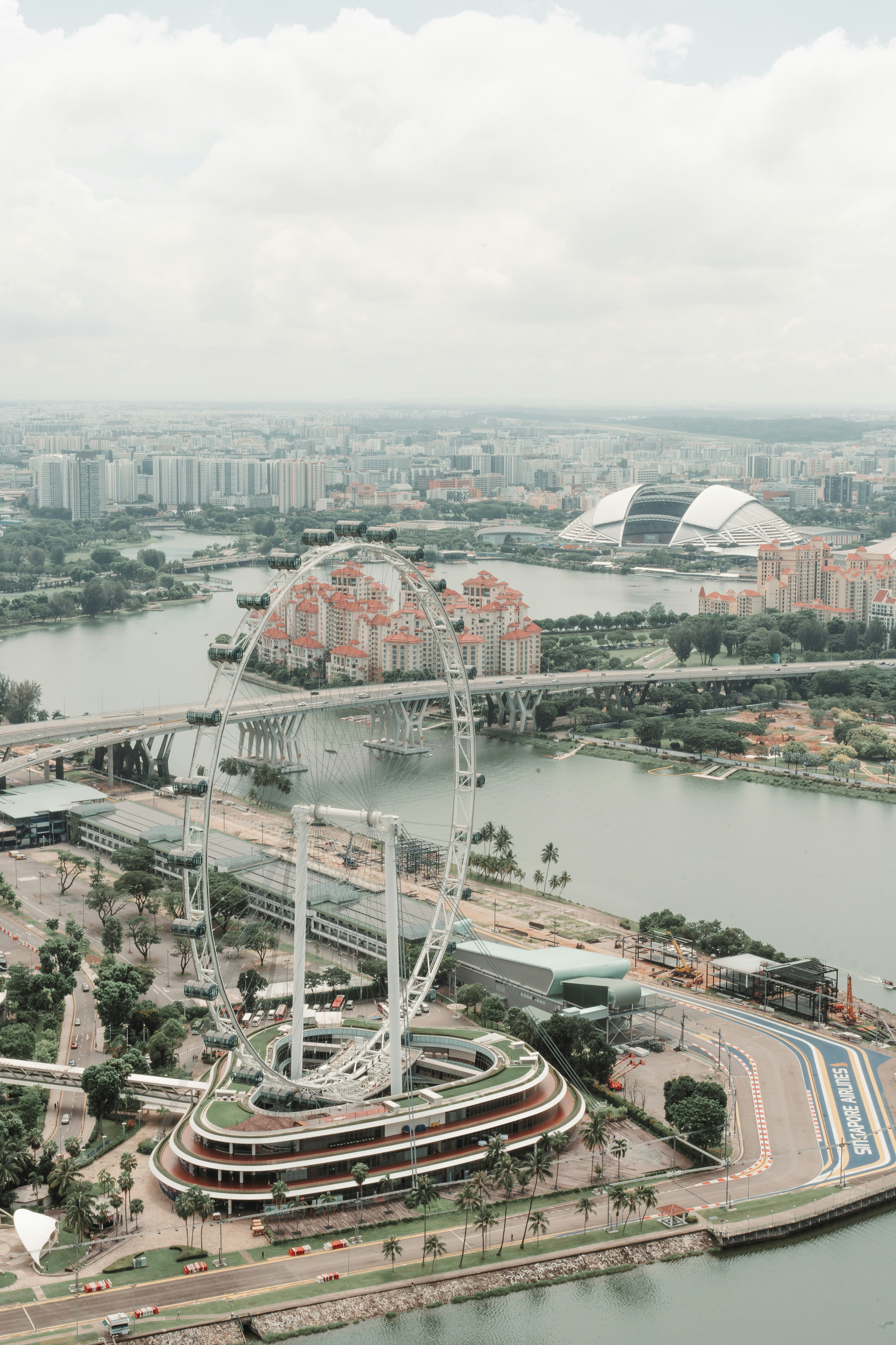 An aerial view of a city with a ferris wheel