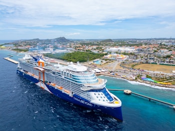 A large cruise ship in the middle of the ocean