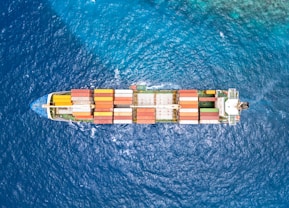 An aerial view of a cargo ship in the ocean