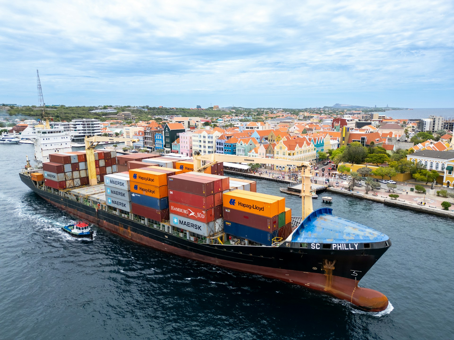 A large cargo ship in the middle of a body of water