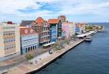 A large body of water next to a row of buildings