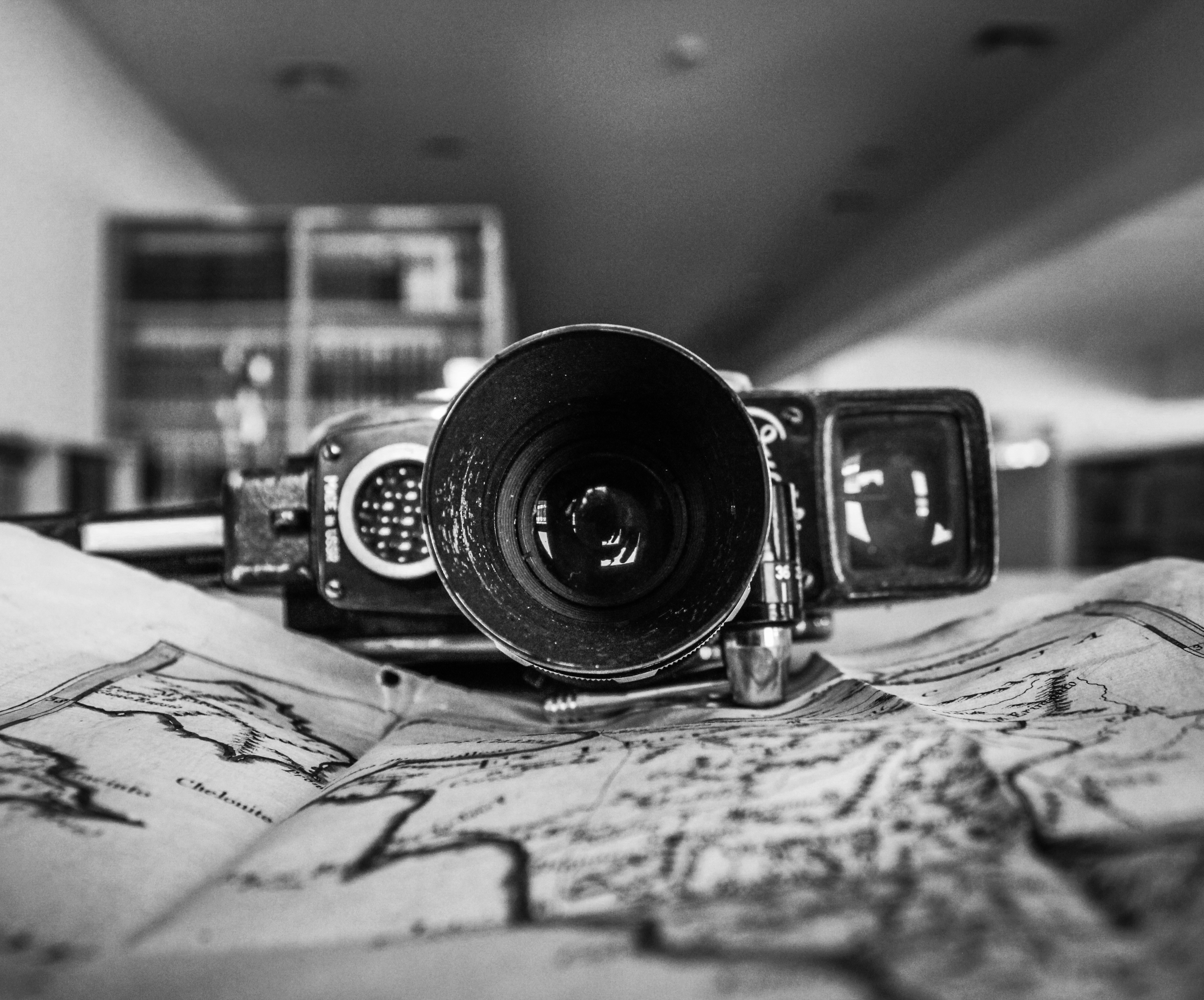 A camera sitting on top of a map