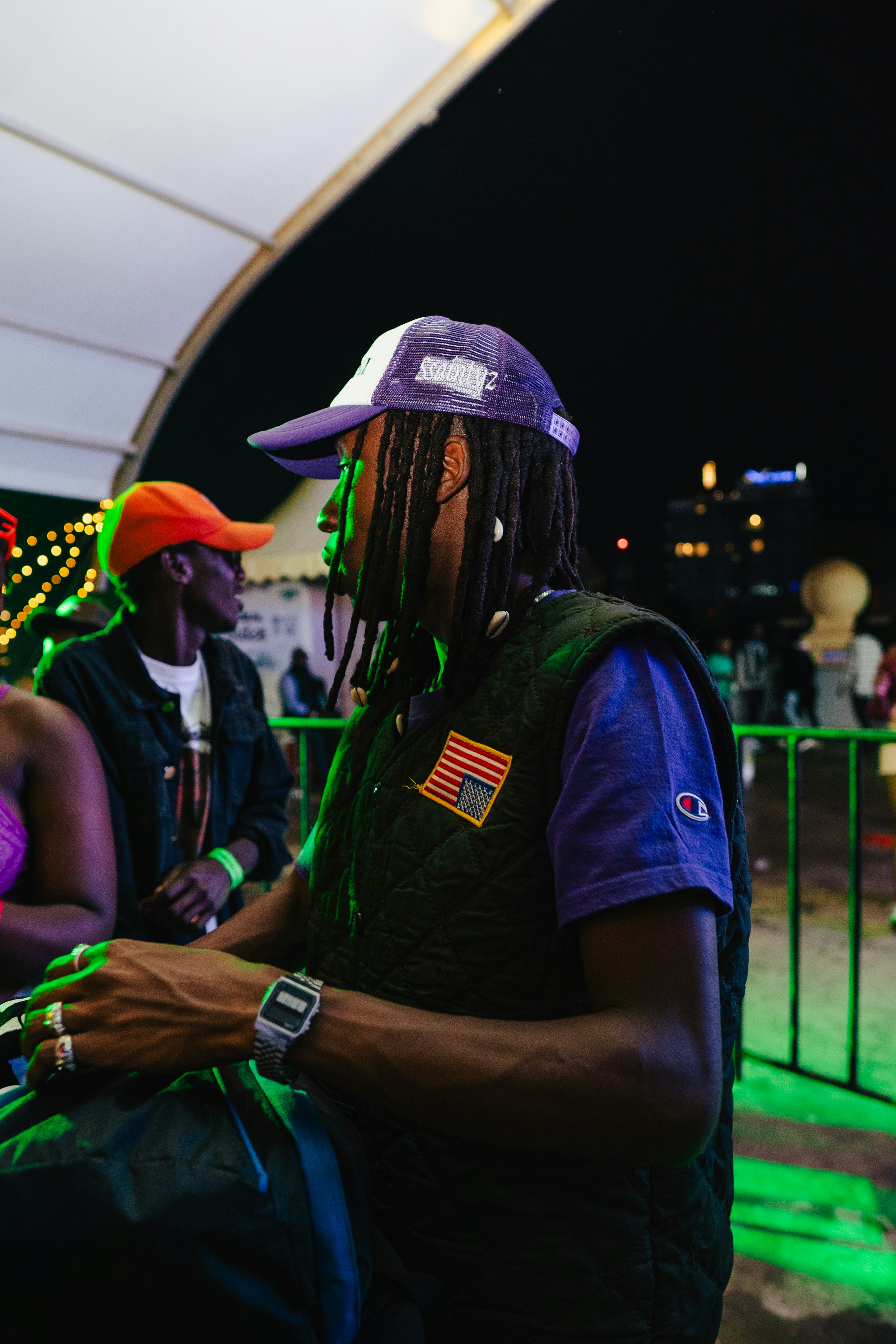 A group of people standing around each other