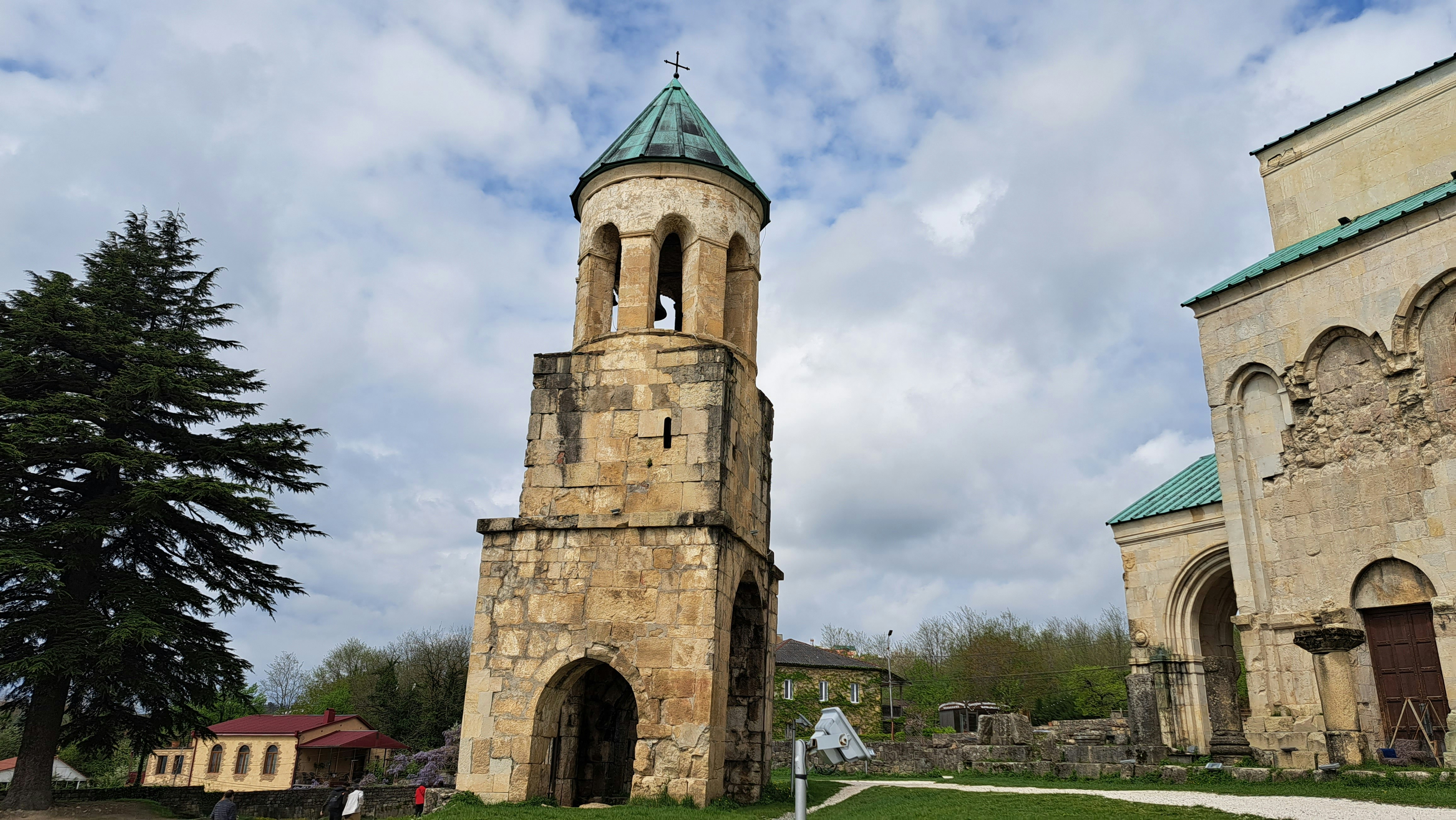A church with two towers and a green roof, Bagrati Cathedral, Kutaisi, Georgia