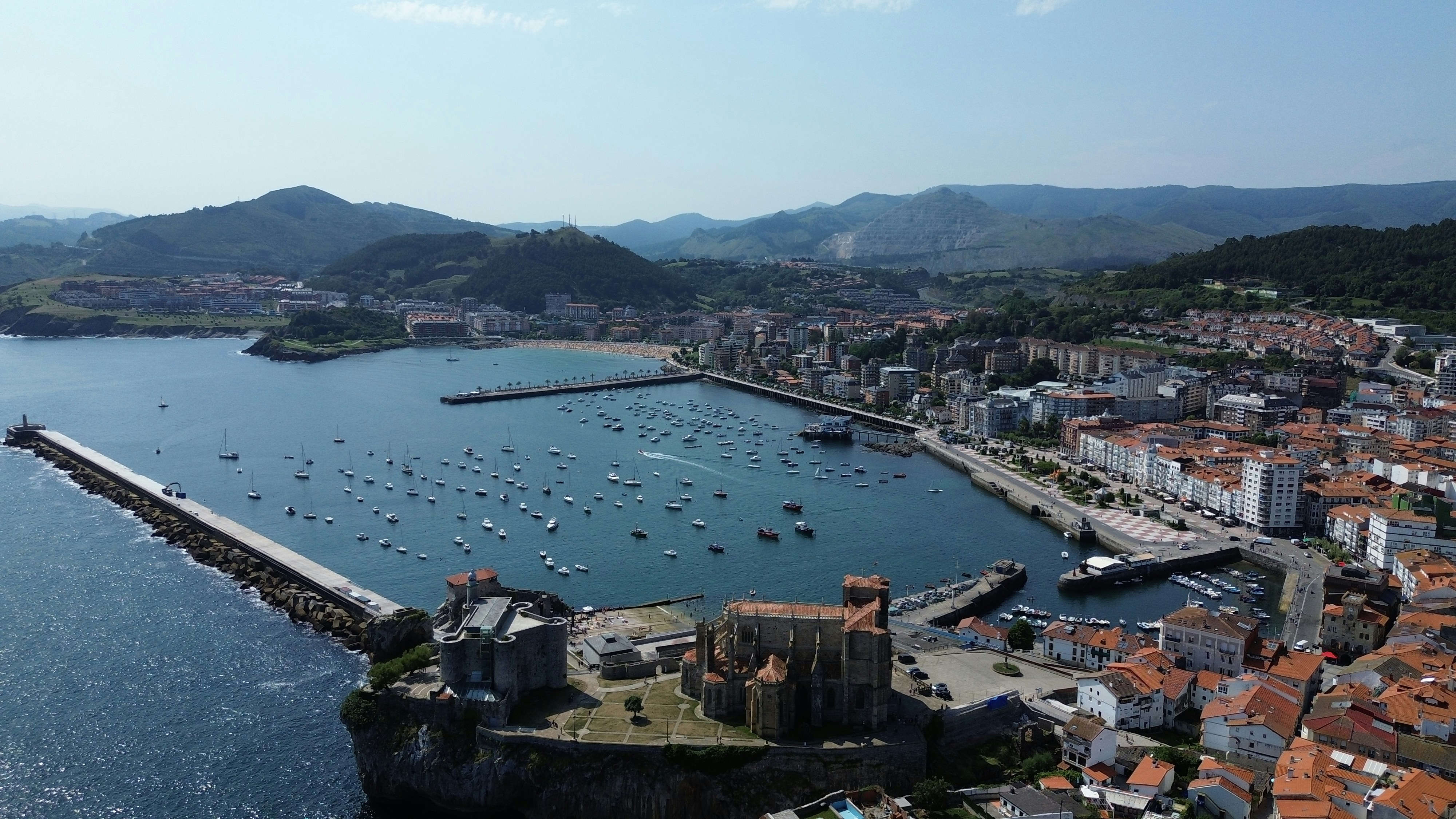A large body of water surrounded by a city