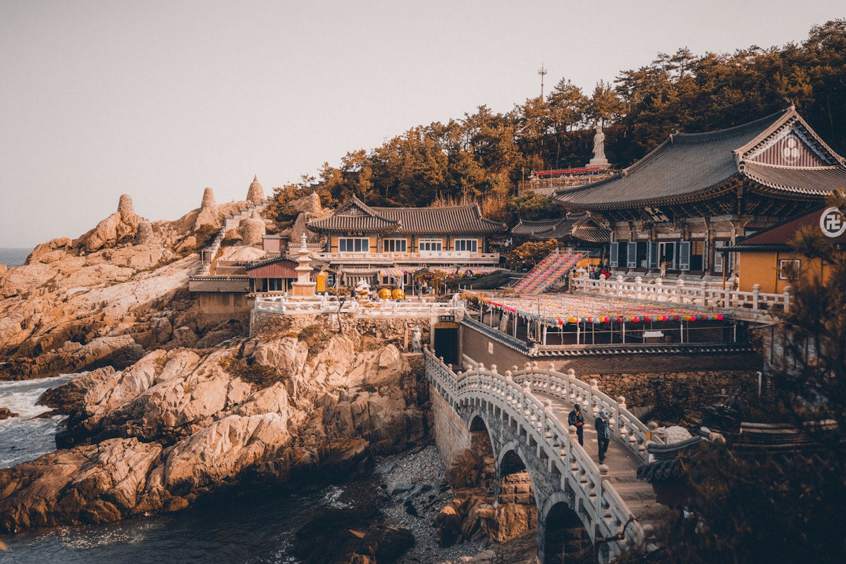 Jagalchi Busan — the harbour area with a traditional wooden bridge near the sea cliff