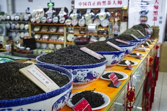 A store filled with lots of bowls filled with dirt