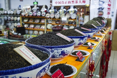 A store filled with lots of bowls filled with dirt