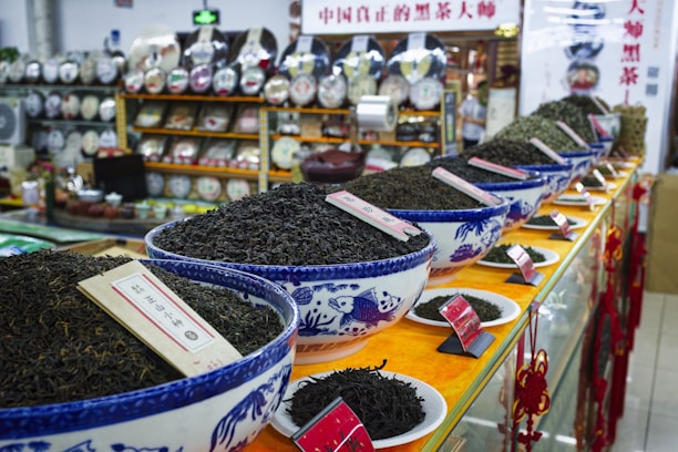 A store filled with lots of bowls filled with dirt