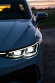 A close up of the headlights of a car