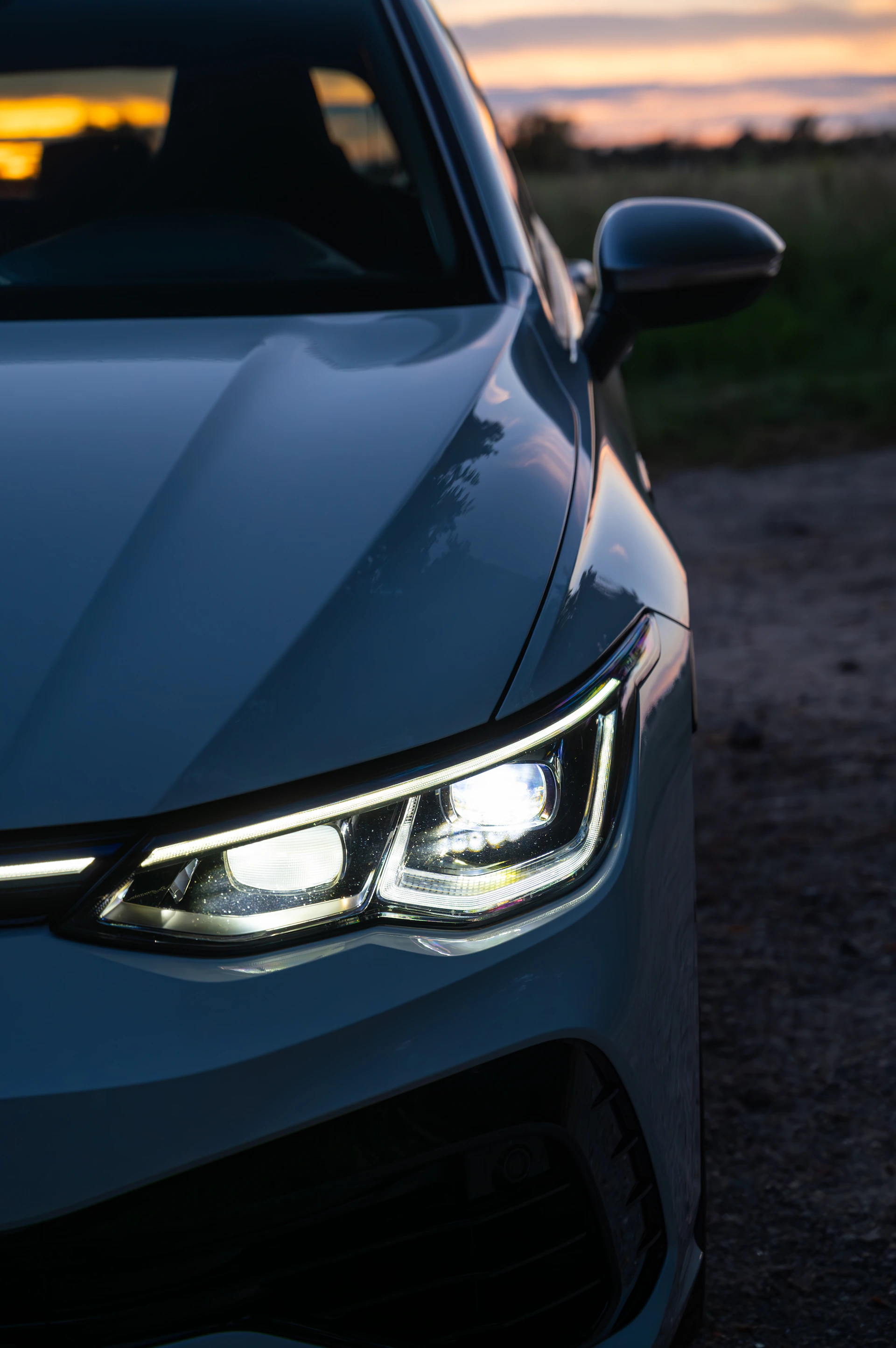 A close up of the headlights of a car