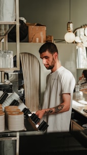 A man standing in a kitchen preparing food